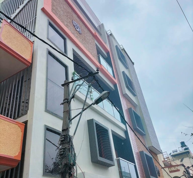 Close-up of a sturdy balcony safety net installed on a Pune apartment, showing fine mesh and secure 