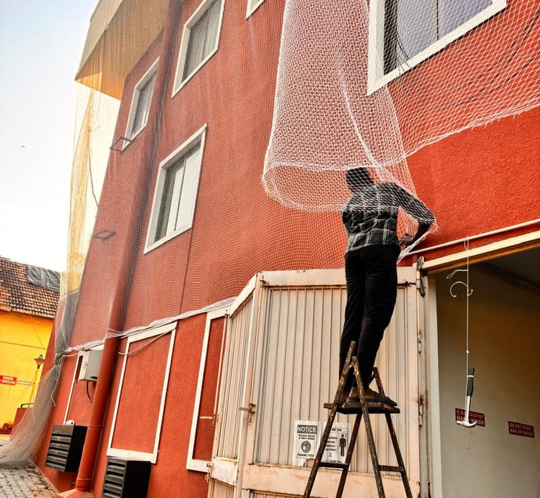 Close-up of a sturdy balcony net expertly fitted to protect against pigeons in a Chennai apartment.