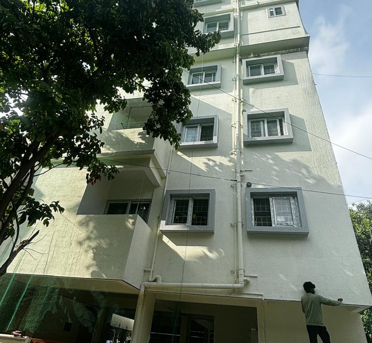 Close-up of a freshly installed pigeon safety net on a balcony in Adyar, showing the fine mesh