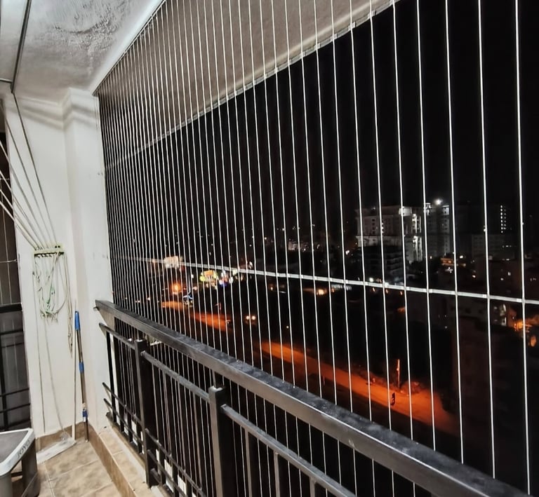 Wide shot of a modern Mylapore home featuring a transparent invisible grill blending seamlessly with