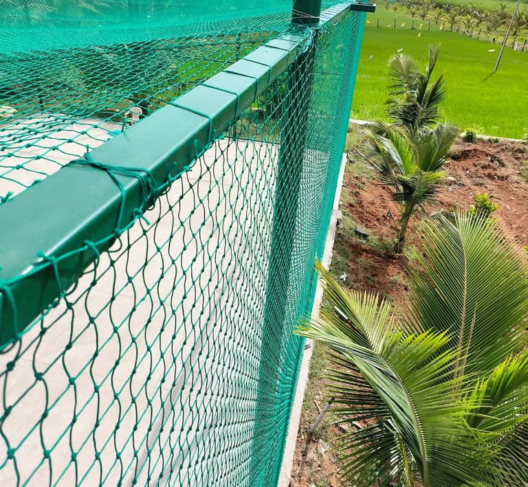 Volleyball practice nets stretched across a community ground, ready for action.