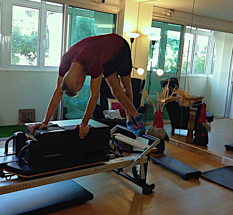 Client performing reformer leg exercise at The Pilates Room Bangsar