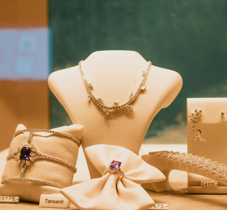 Luxury tanzanite and diamond jewelry set featuring a necklace, ring, and bracelet on display.