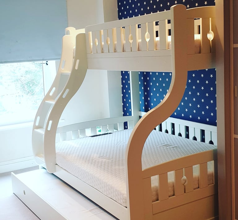 flat pack assembled bunk bed with a pull out trundle bed
