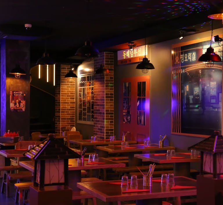 a restaurant with a large table and chairs