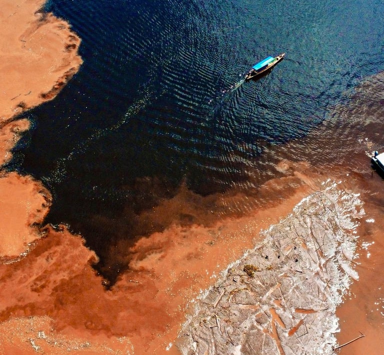 a boat is in the water near a beach