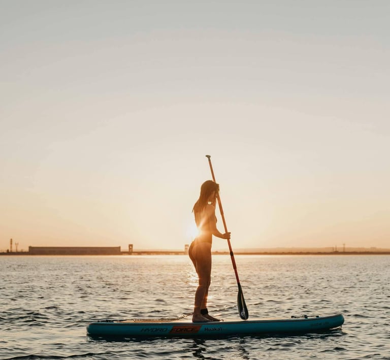 a woman in a bikinisuit paddles on a paddleboard, Morro do São Paulo, Brazil