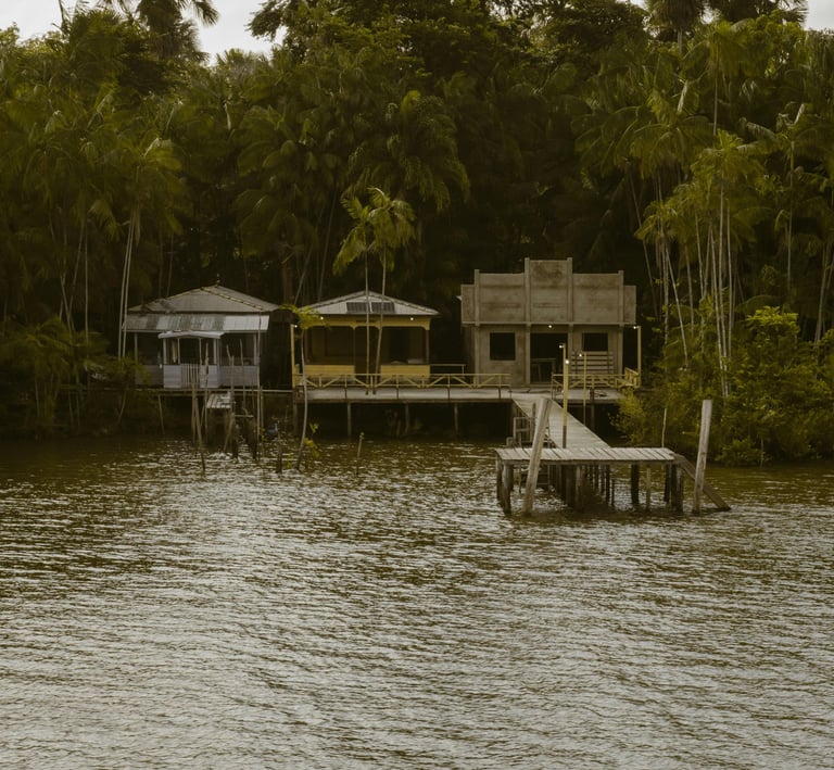 a boat dock with a house on the water