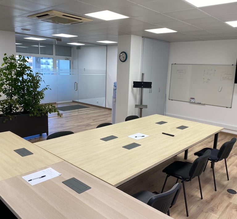 a conference room with a large table and chairs
