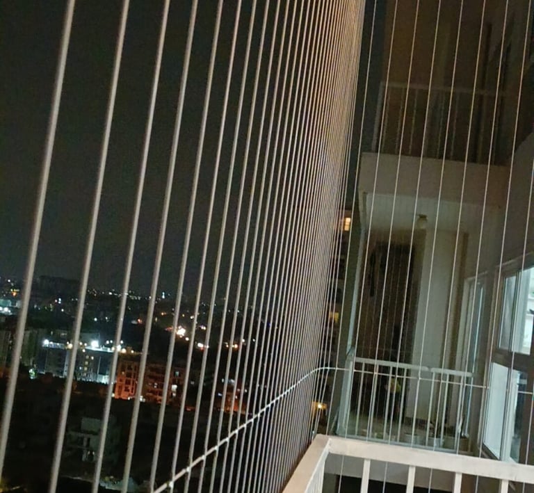 Invisible grills fitted seamlessly on a window, blending with the frame.