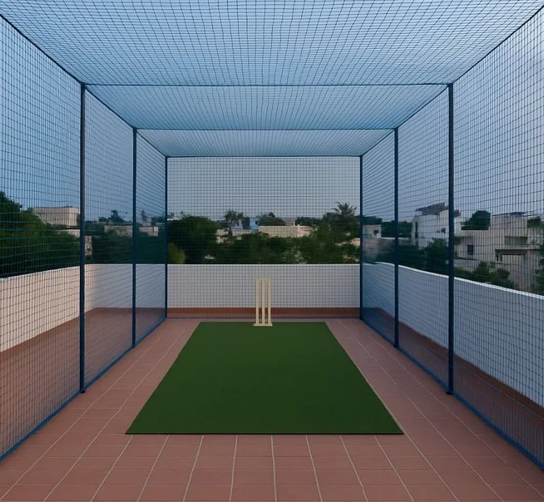 Wide shot of a football field surrounded by sturdy safety nets in Electronic City.
