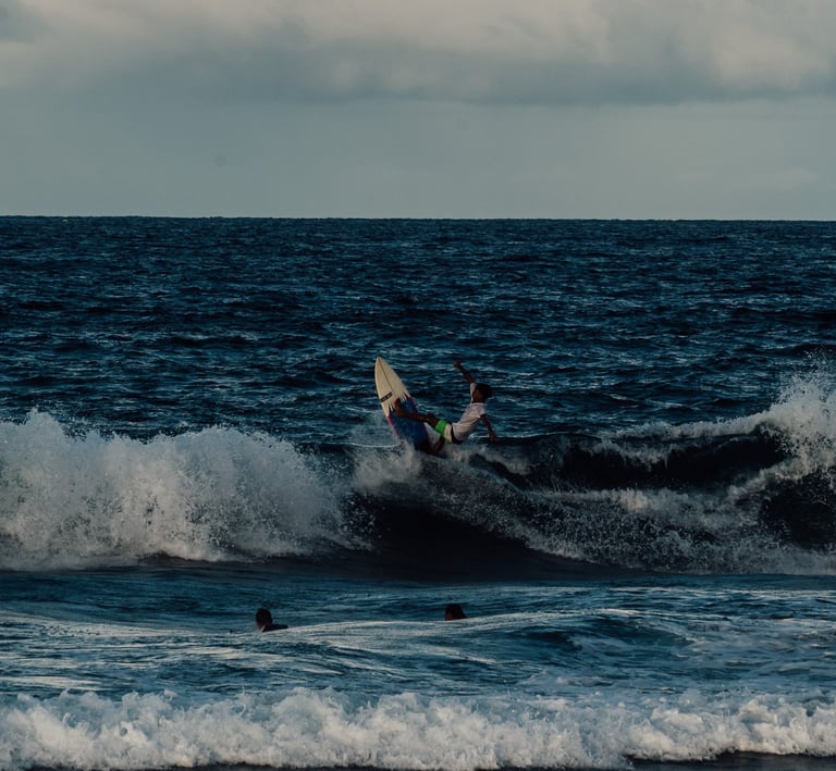 a person surfing on a wave in the ocean