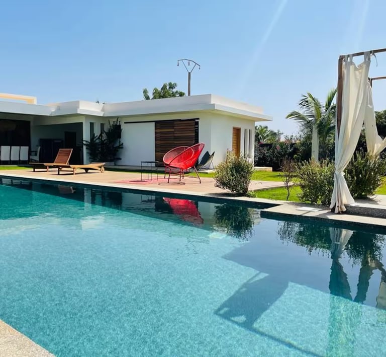 a pool with a red chair and a red chair