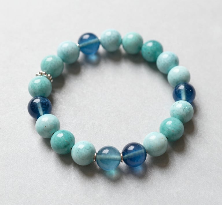 Close-up of a pair of handcrafted earrings made from recycled metals.