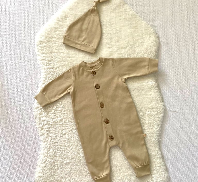 a classy baby's outfit is shown, colors are bright and beautiful