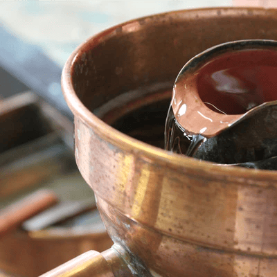 Eau de vie, qui coule dans l'alcoometre 