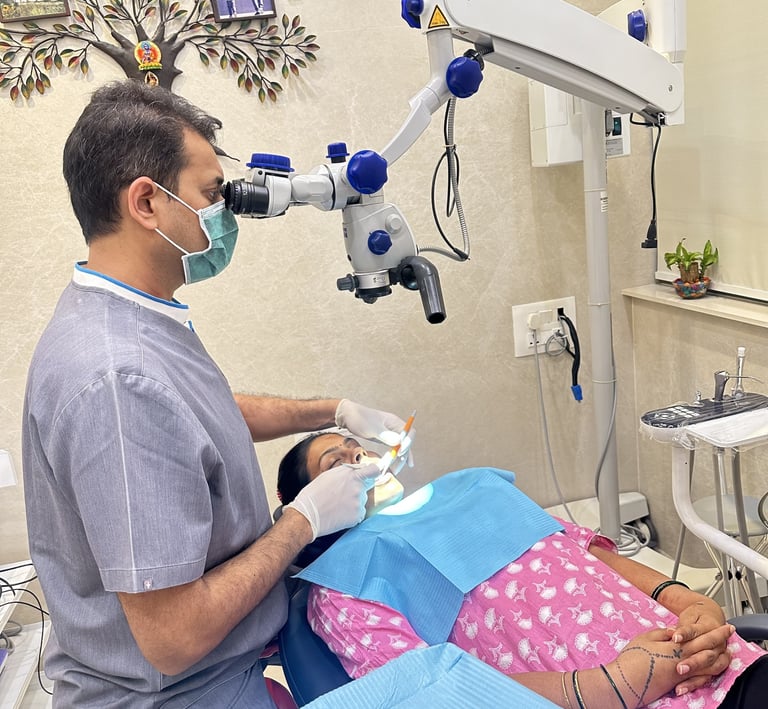 best micro-endodontist root canal specialist in mumbai doing painless root canal treatment with microscope