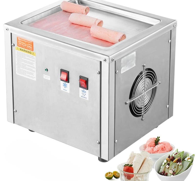 Stainless steel commercial rolled ice cream machine with frozen treats on a flat cooling plate.