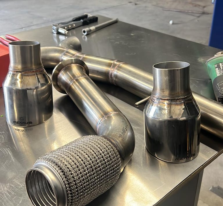 a couple of exhaust pipes on a table