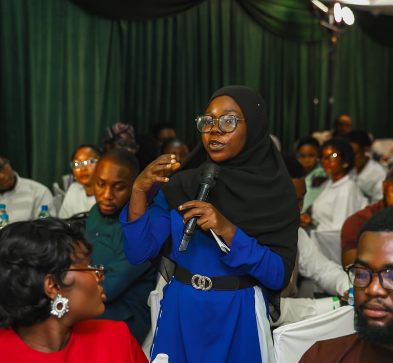 Participant asking questions to the panelists