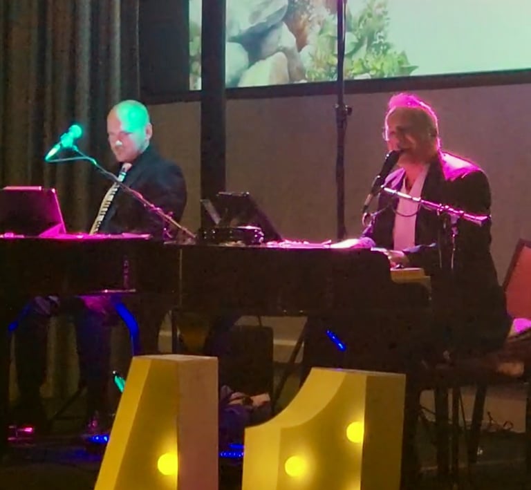 Karey Nickel plays with a fellow performer for a corporate event