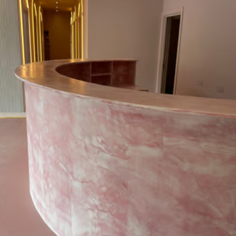 A pedicure station featuring a rose design in a modern spa, with warm LED lighting.