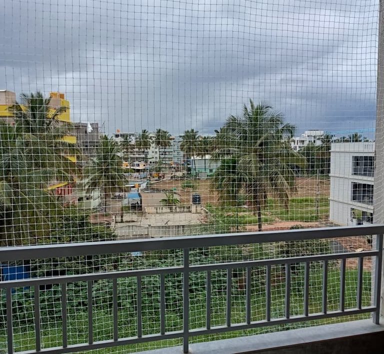 Evening shot of a safety net glowing softly under ambient city lights in Mumbai.