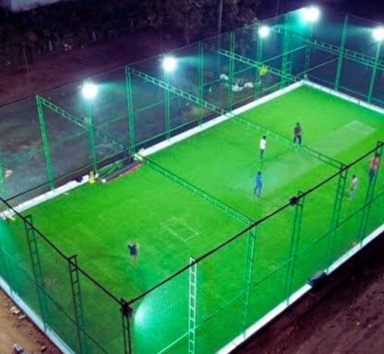 Technicians from Arjilli Safety Nets carefully fixing the nets along the terrace edges, focused and 