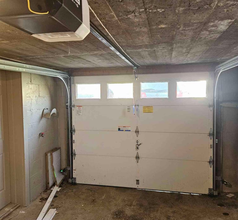 Inside view finfishing up a new door and opener.