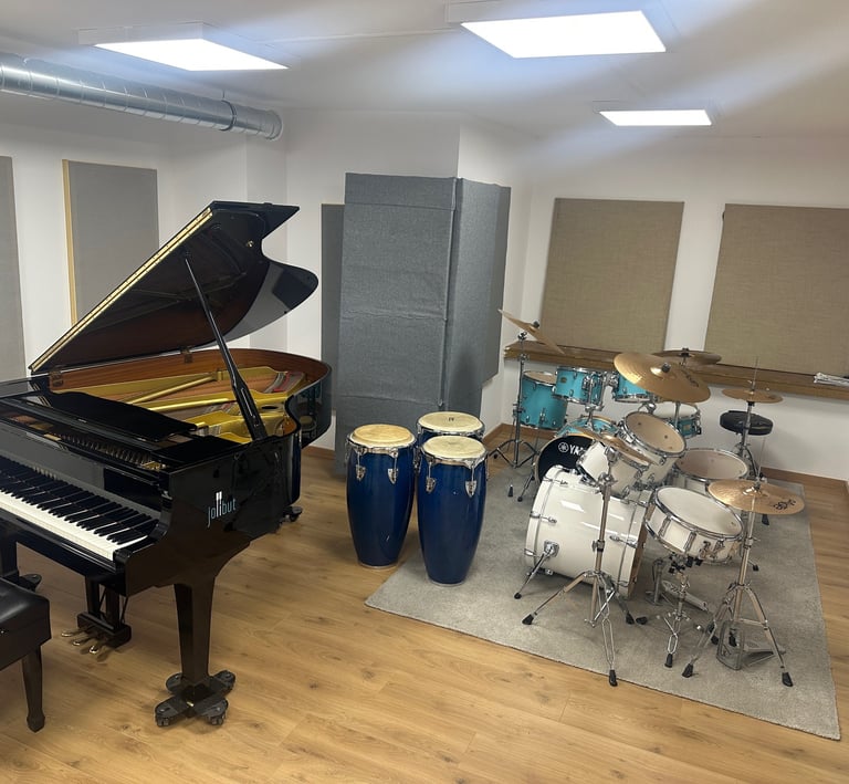 a piano and drums in a room with a latin percussion