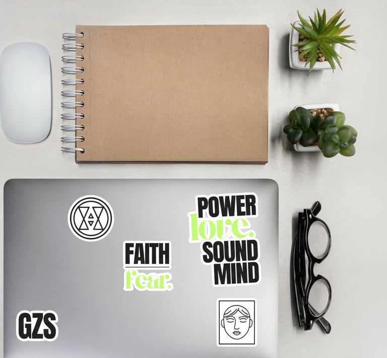 a laptop computer sitting on a desk with a notebook and a notebook