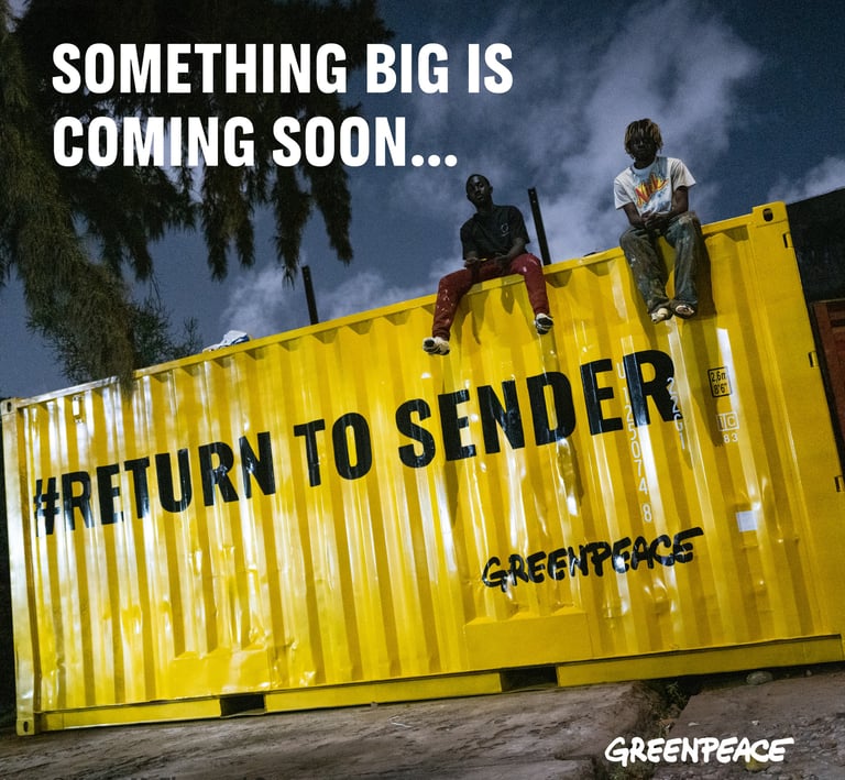 a man sitting on a container container with another man standing on the side of the