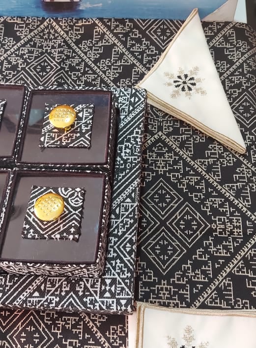 a table with a table cloth and napkins