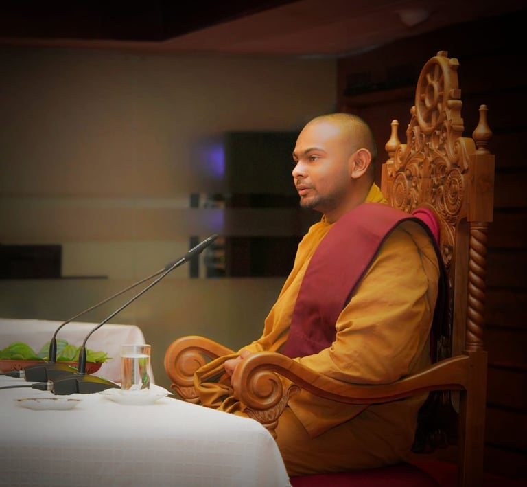 a monk monk in a chair with a microphone