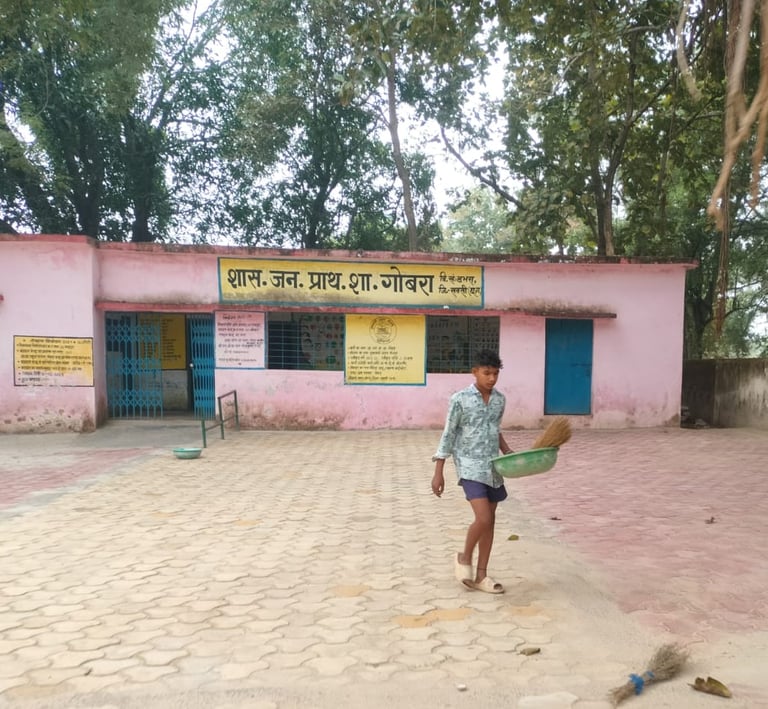 boy with broom and bucket