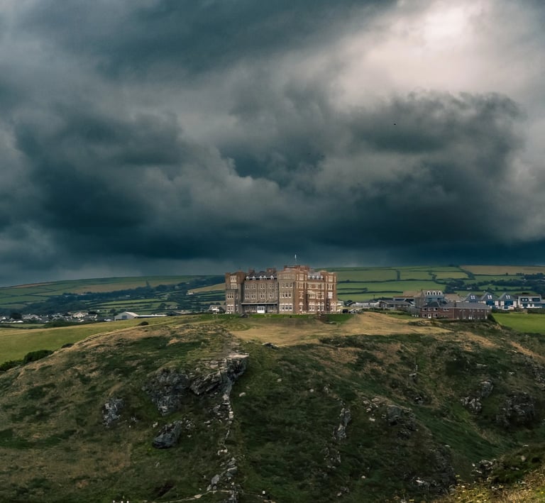 a castle like building with a large tower in the background