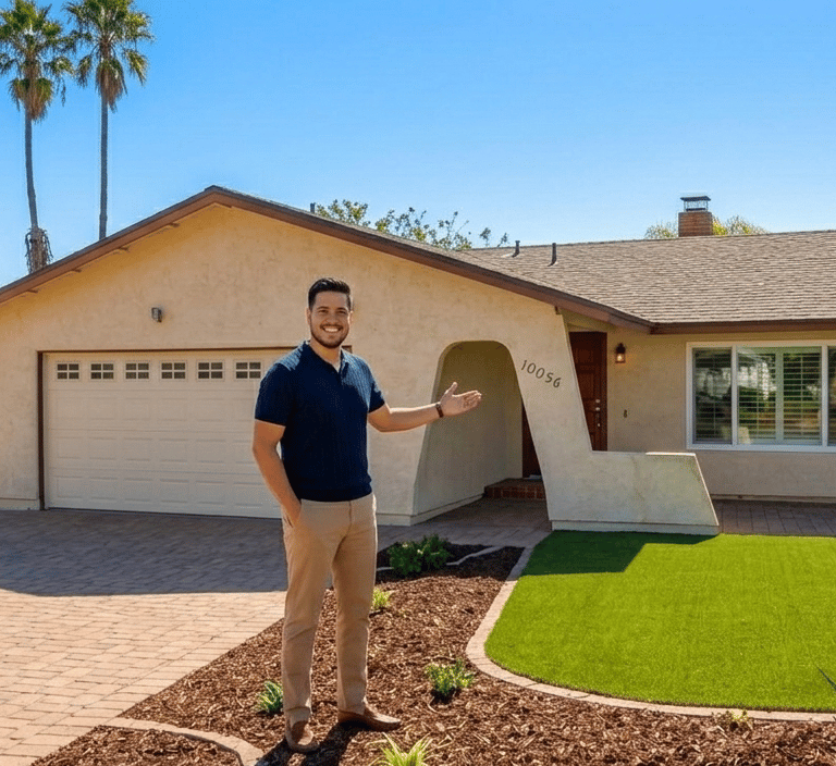 A smiling male (owner) standing in front of Wholesome Haven, a suburban ranch-style home