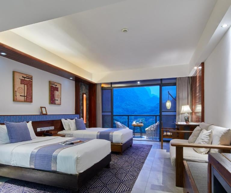 Spacious twin room at Li River Resort in Yangshuo with a balcony
