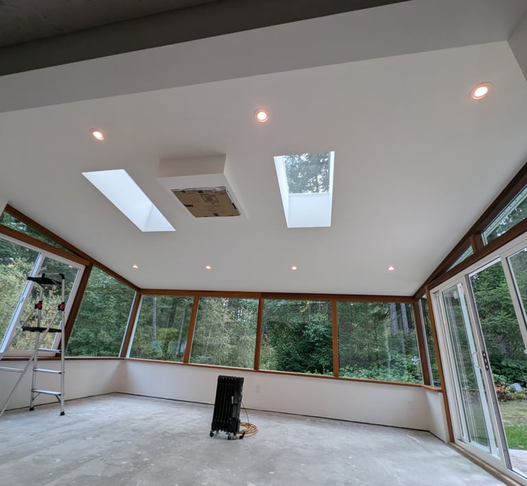 Residential sunroom addition with recessed LED ceiling lights and skylights Victoria BC