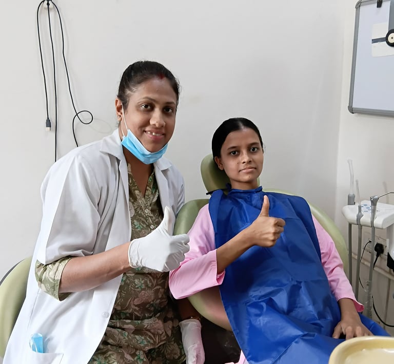 Dr Kamana Vijay Rai dentist at Rps Dental Clinic smiling with happy dental patient