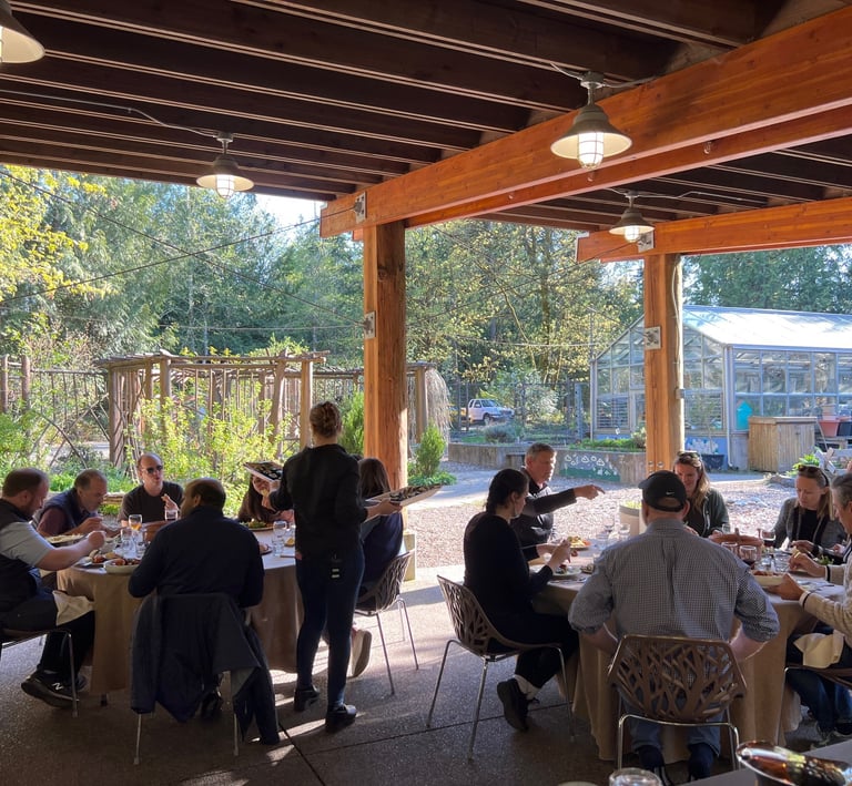 Seattle corporate team eating lunch outdoors during a team building experience