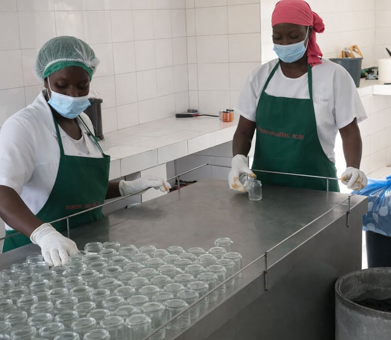 two women in masks and masks on a counter