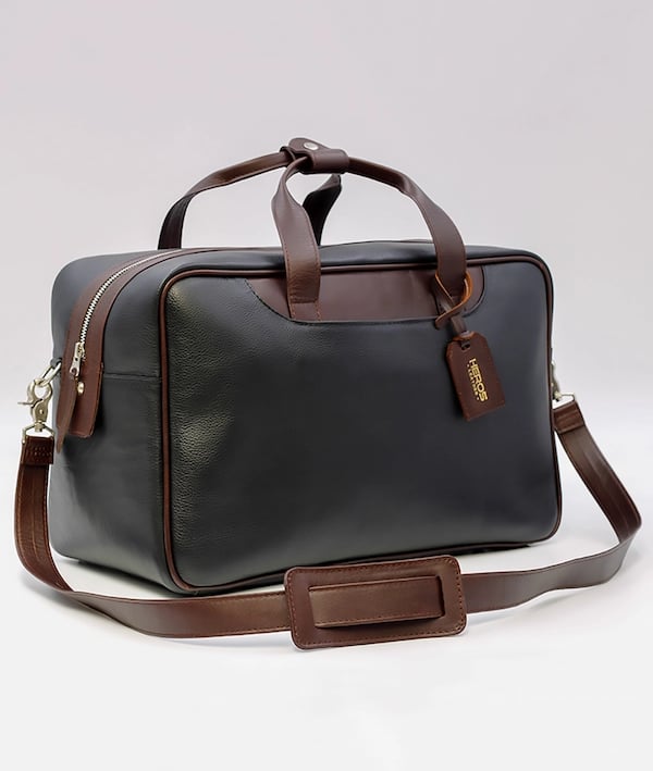 a black and brown briefcase with a brown leather bag