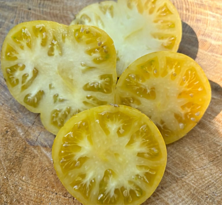 PINEAPPLE PIG | Large, juicy beefsteak fruits with striking yellow skin marbled with pink blushes