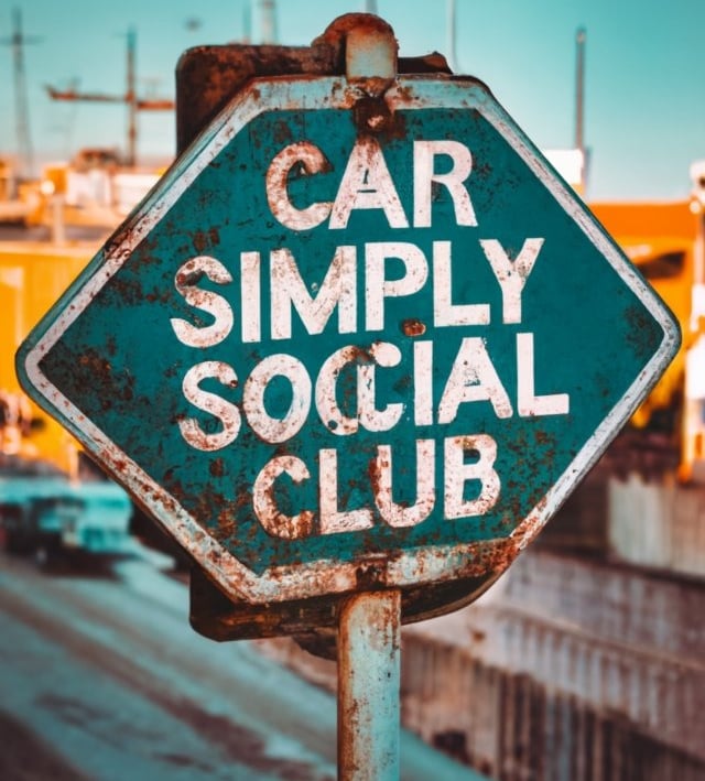 a sign that says car simply social club