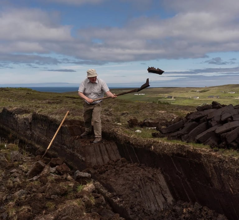 man using slean to cut and throw turf