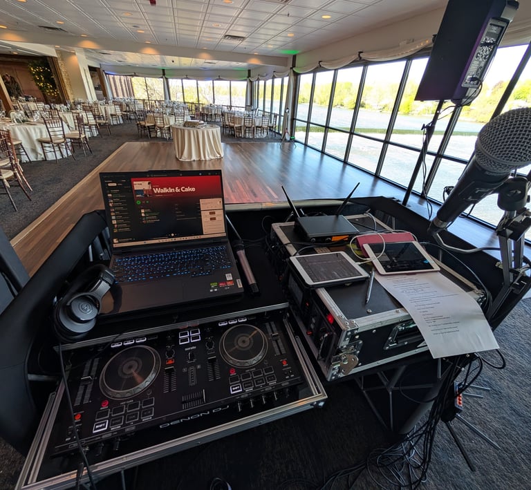 wedding DJ setup with DJ controller, laptop, microphone, ipads, and behringer x32