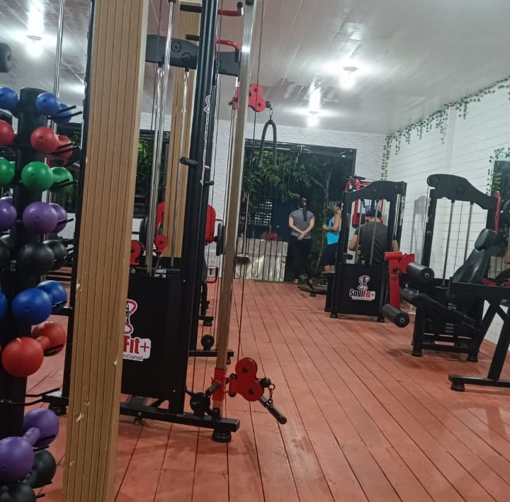 a gym room with a gym equipment and a gym equipment