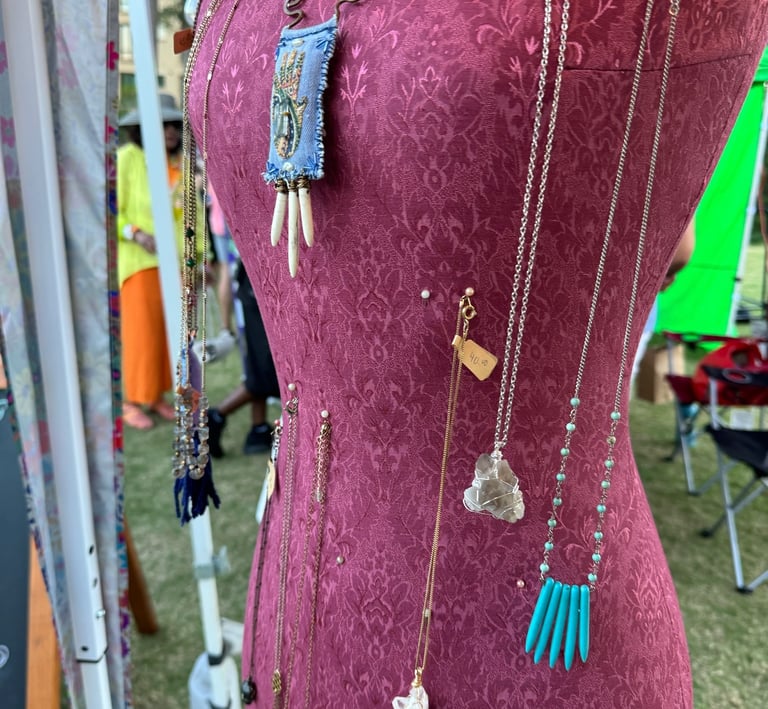 Jewlery made by a vendor pinned on a sewing form