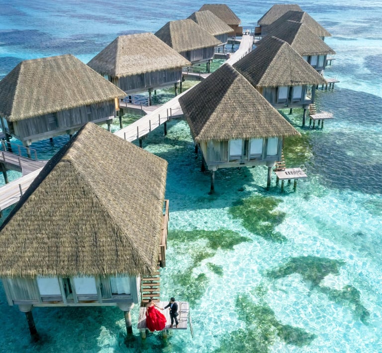 Luxury overwater villas in the Maldives surrounded by crystal-clear turquoise waters – perfect tropical island getaway